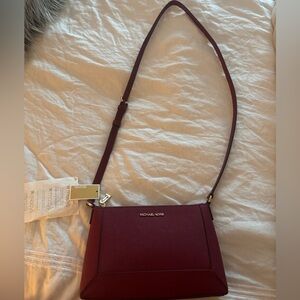 Michael kors leather crossbody bag
New, never worn